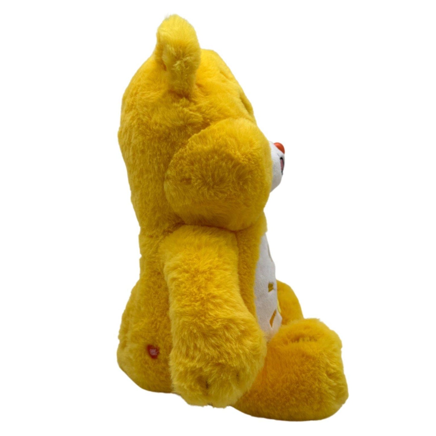 Zijaanzicht van het Zonnebeertje β Funshine Bear met vrolijke gele vacht uit de Care Bears collectie van Make a Bear