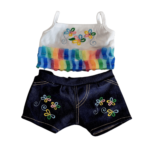 Flower jeans set - voor knuffel - Make a bearFlower jeans set - voor knuffel - Make a bearFlower Jeans set met een zomers topje met spaghettibandjes en geborduurde bloemen, gecombineerd met een spijkerstof broekje voor knuffels.